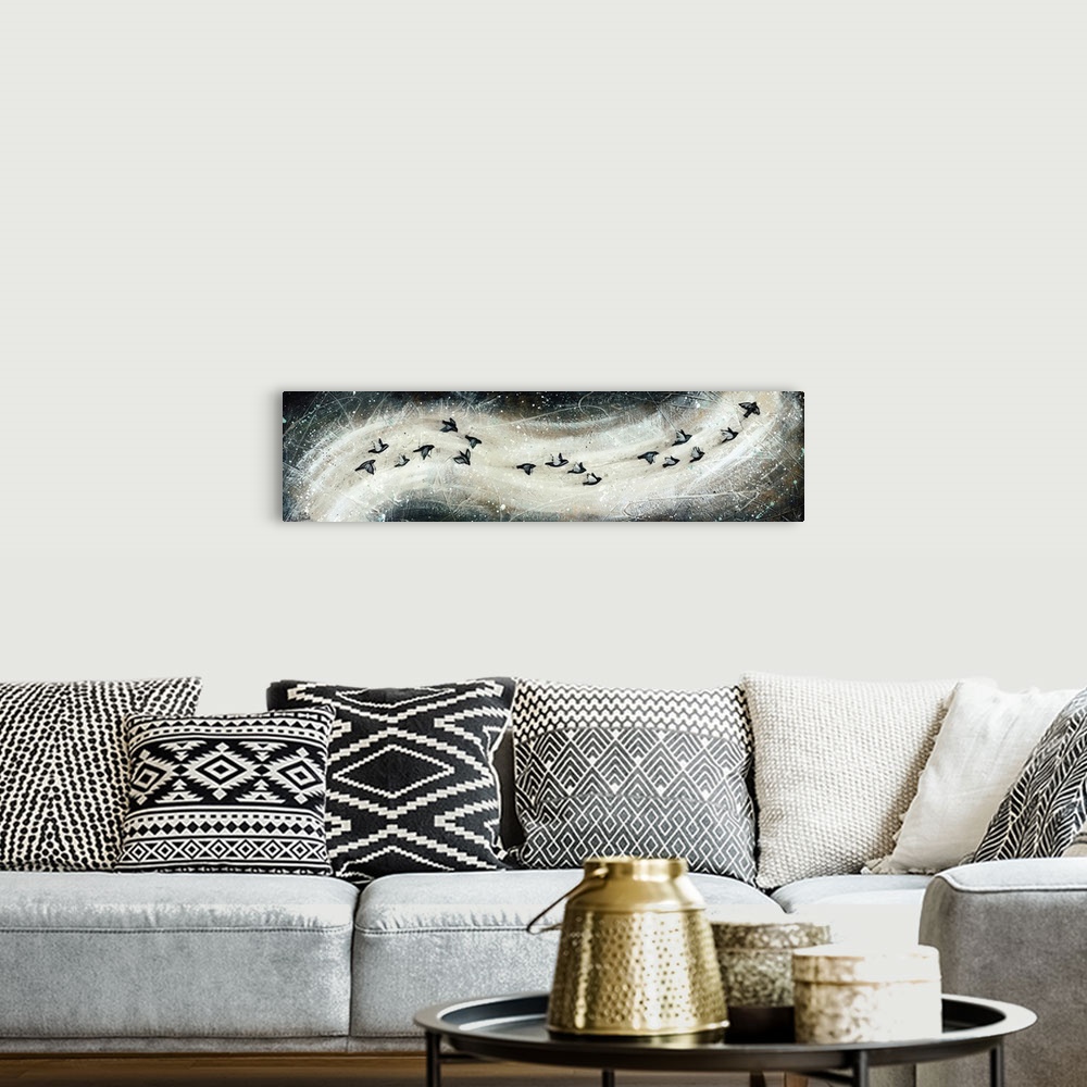 A bohemian room featuring Contemporary art print of a flock of birds in flight, in a swooping formation.