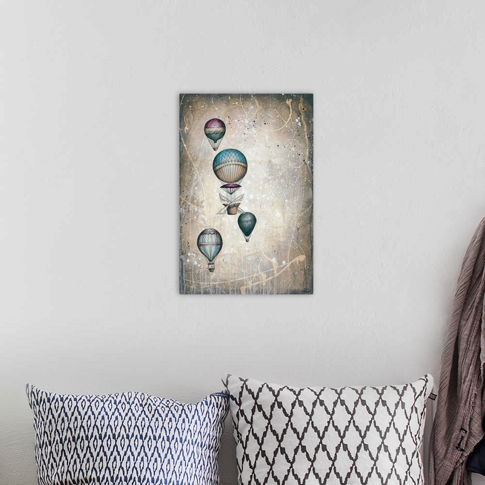 A bohemian room featuring Contemporary artwork of four patterned hot air balloons floating in the sky.