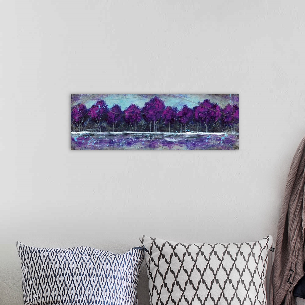 A bohemian room featuring Dreamy painting of a forest of deep purple trees at the edge of a clearing.