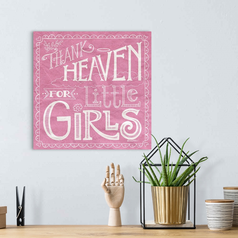 A bohemian room featuring Handlettered home decor art for a girl's room, with white lettering against a distressed pink bac...
