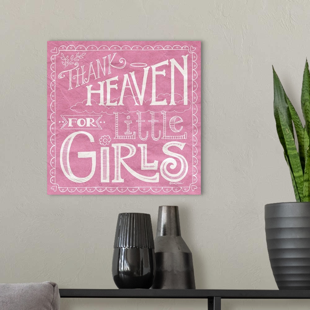 A modern room featuring Handlettered home decor art for a girl's room, with white lettering against a distressed pink bac...