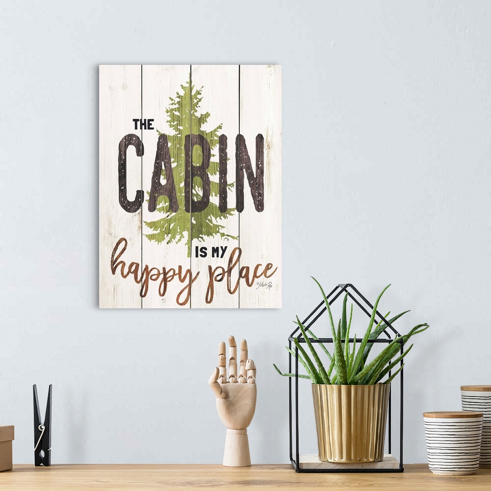 A bohemian room featuring Fun lodge-themed sign with a pine tree motif on a wooden board background.