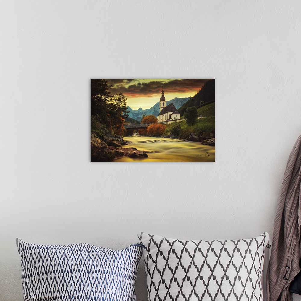 A bohemian room featuring Photograph of a peaceful landscape.