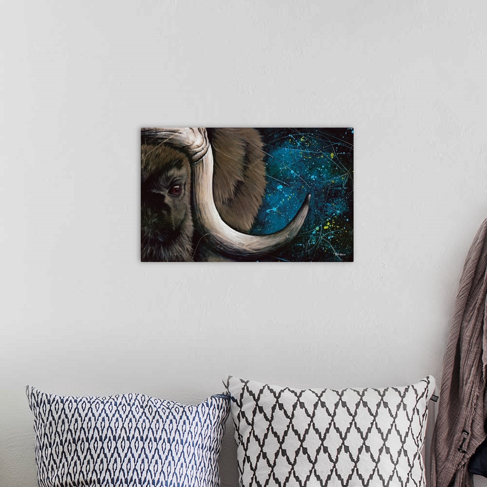 A bohemian room featuring Contemporary artwork of a close up musk ox's eye and horn.