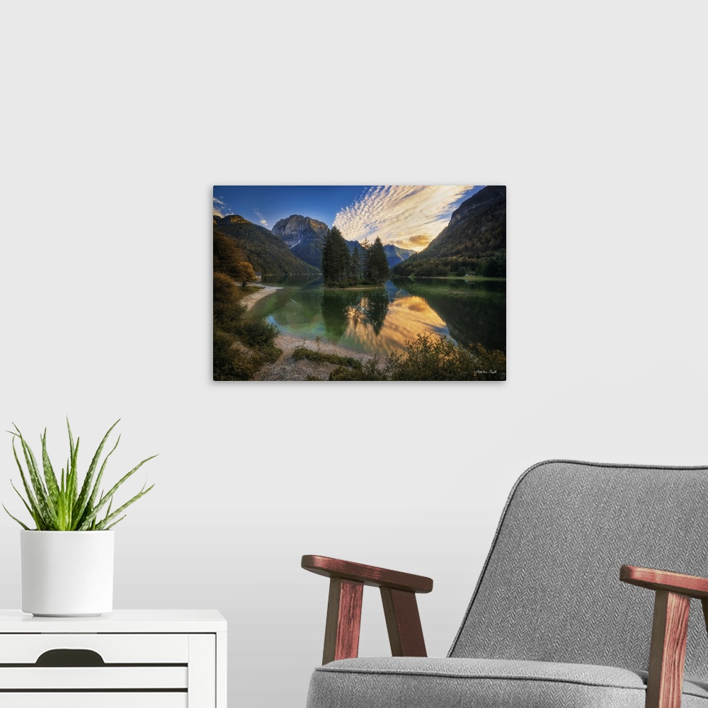A modern room featuring Peaceful mountain lake under a blue sky with clouds in the afternoon.