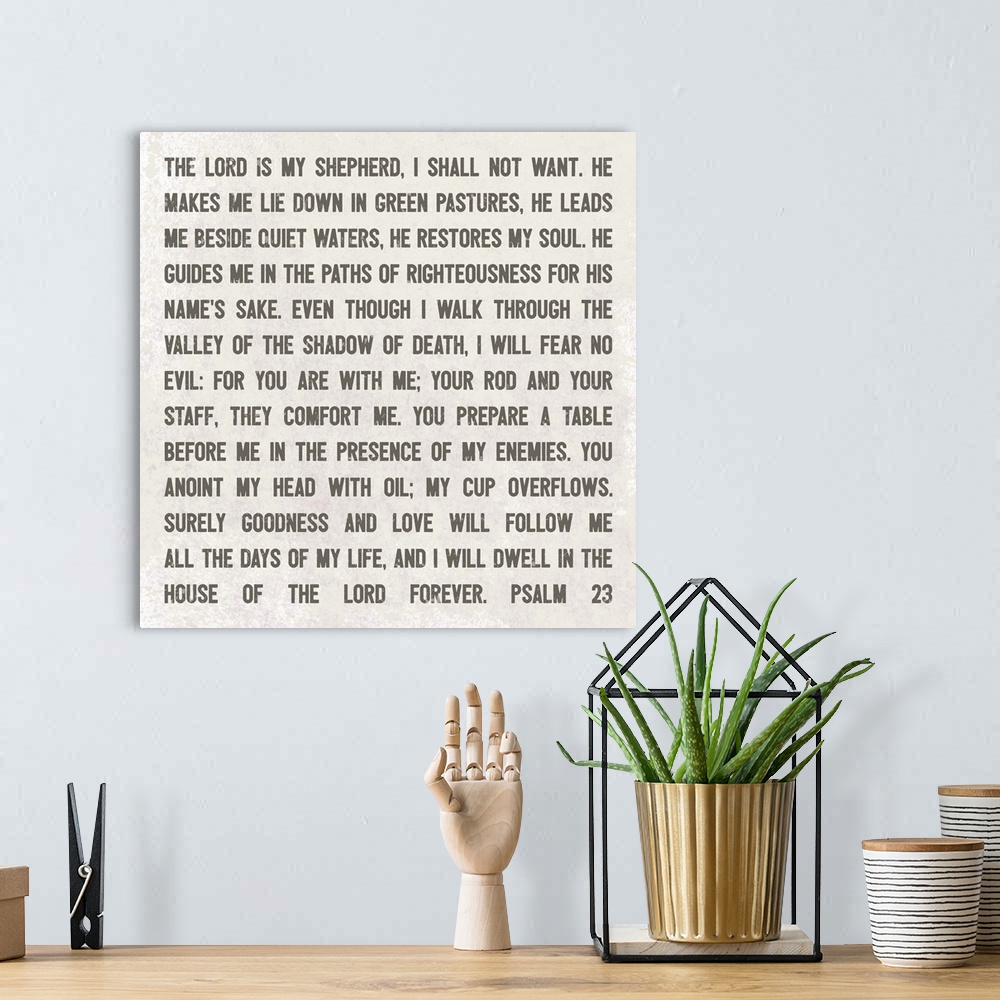 A bohemian room featuring Decorative artwork featuring Psalm 23 bible quote.