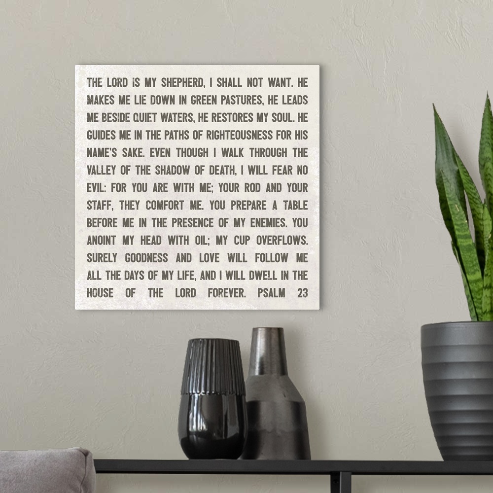 A modern room featuring Decorative artwork featuring Psalm 23 bible quote.