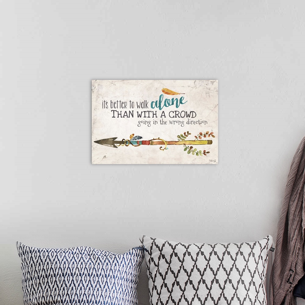 A bohemian room featuring An inspirational phrase decorated with a colorful arrow design.