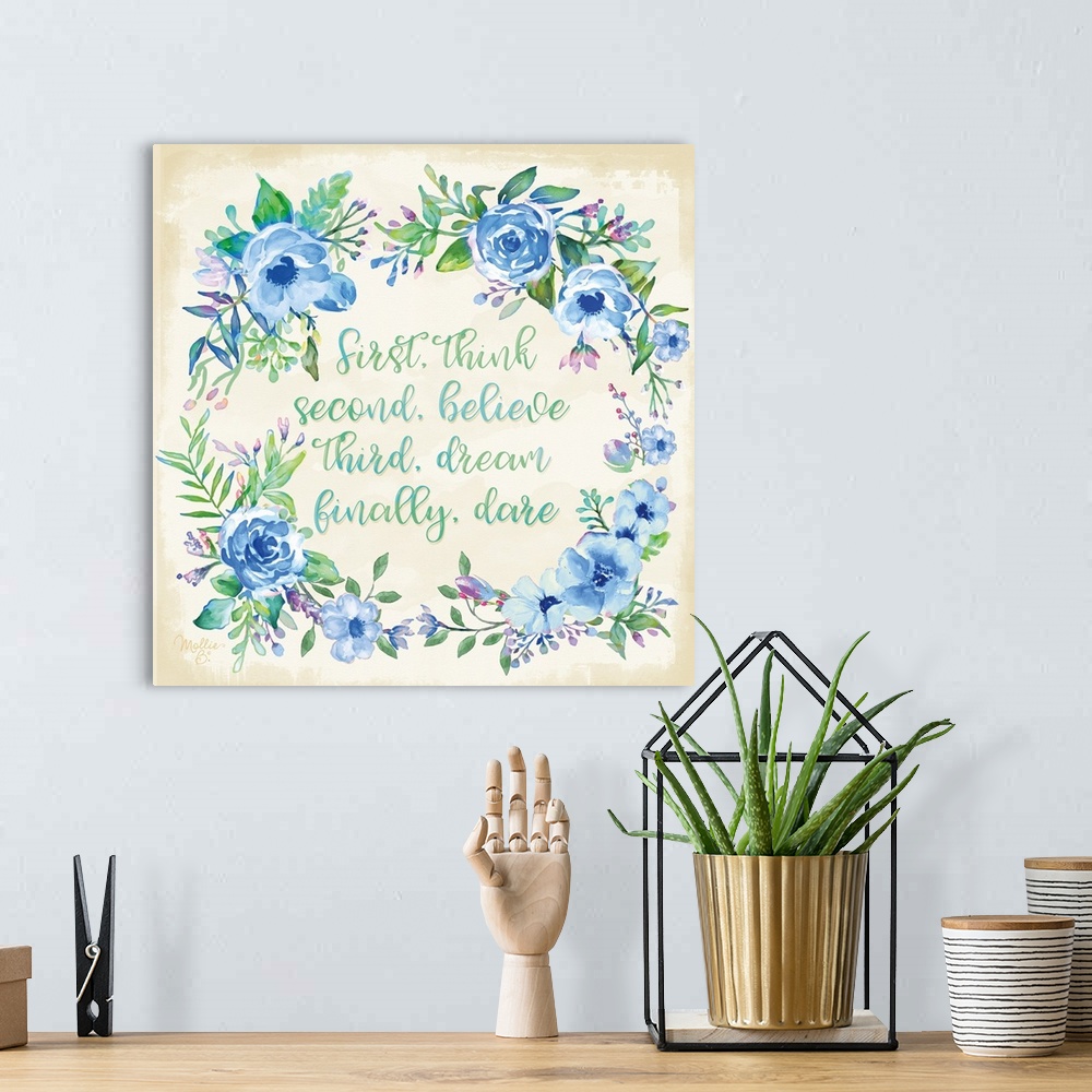 A bohemian room featuring Inspiring quotation surrounded by a wreath of blue flowers and green leaves.
