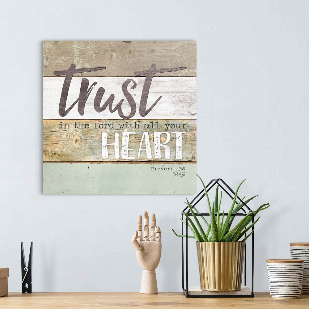 A bohemian room featuring Bible verse Proverbs 3:5 on a background of varied wooden boards.