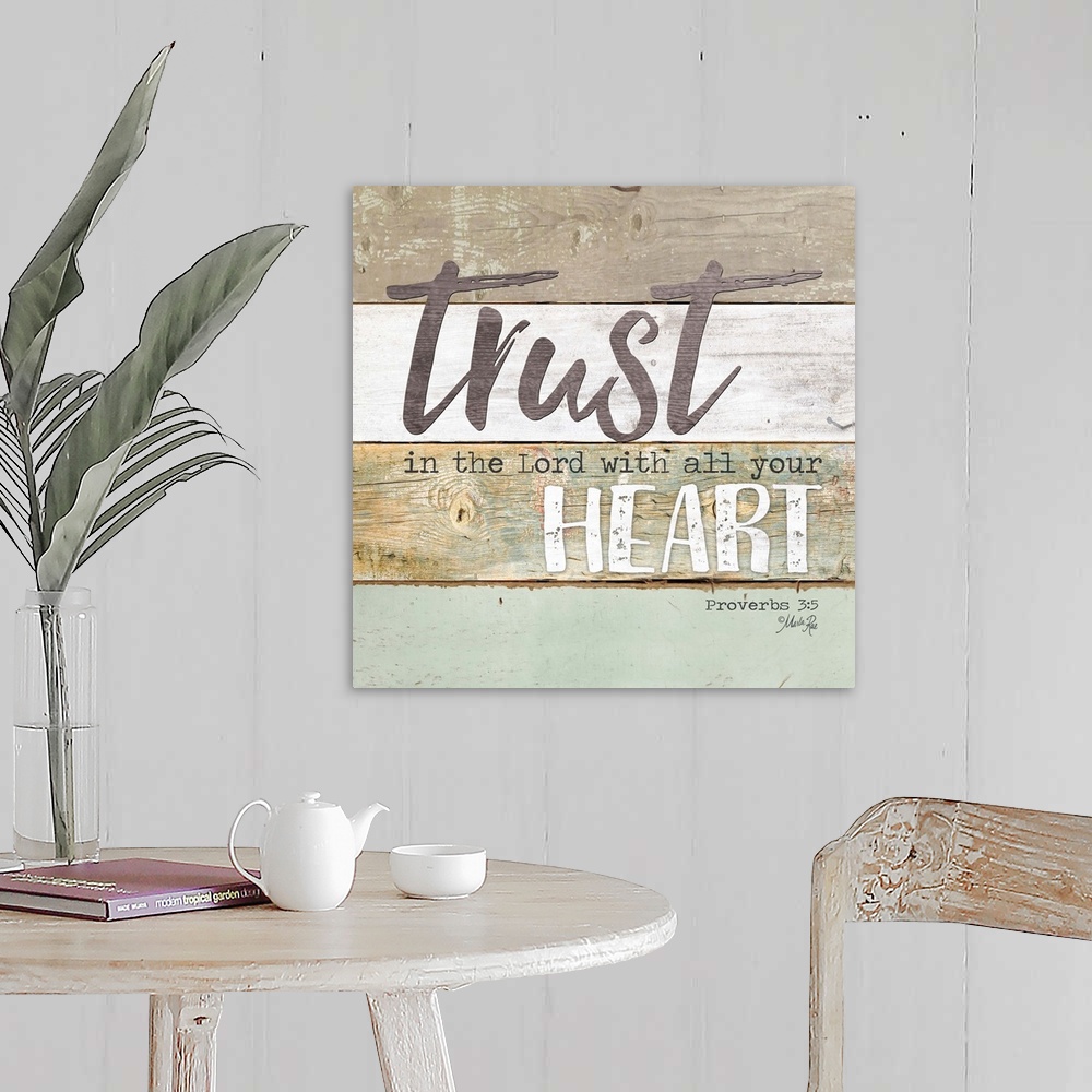 A farmhouse room featuring Bible verse Proverbs 3:5 on a background of varied wooden boards.