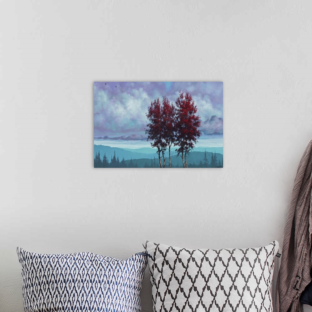 A bohemian room featuring Contemporary artwork of two tall trees with red leaves over a blue landscape.
