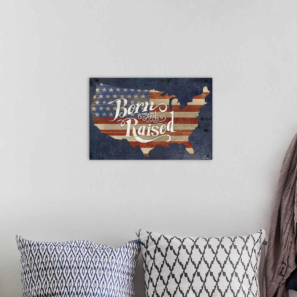 A bohemian room featuring The American flag in the shape of the United States with "Born and Raised" in decorative text.