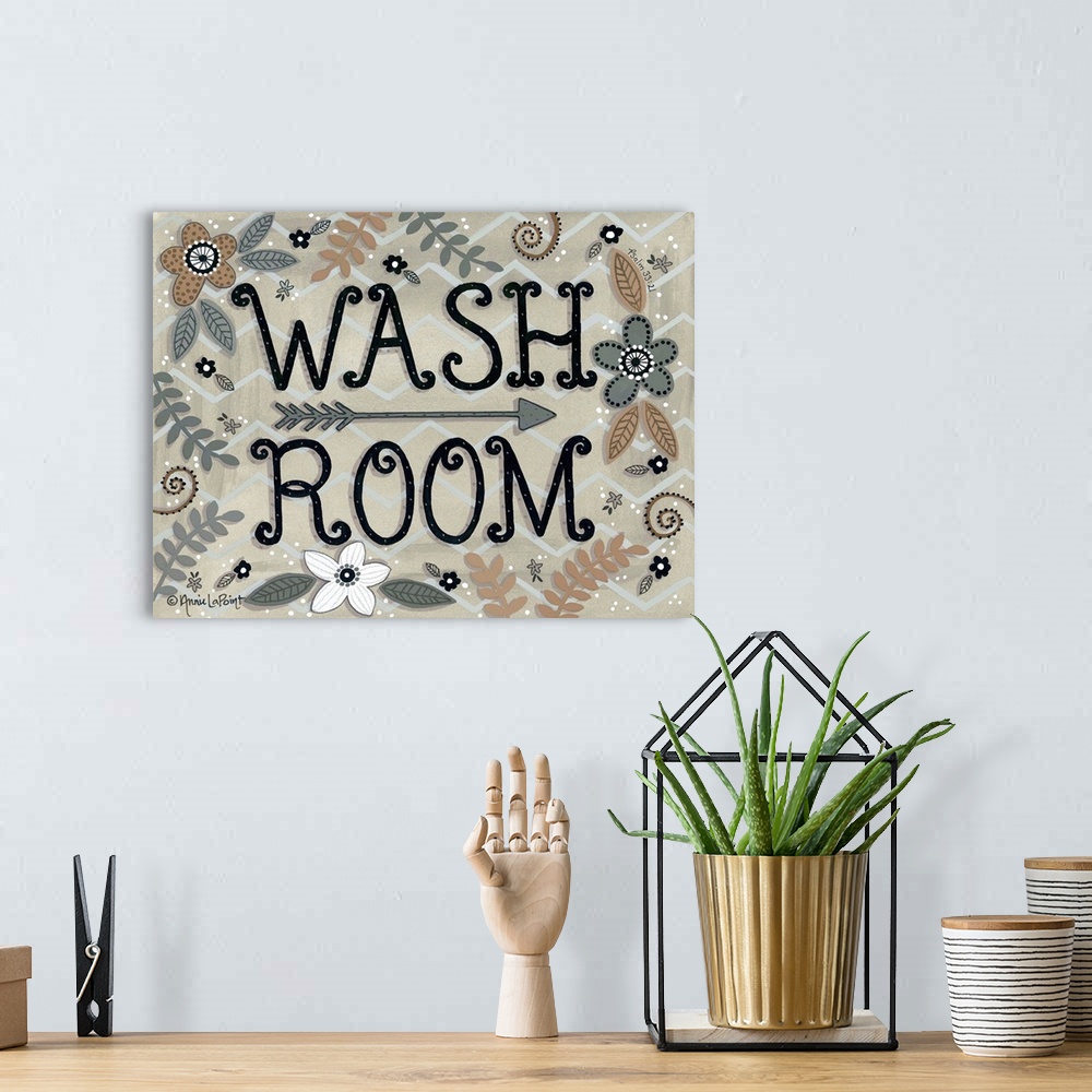 A bohemian room featuring A folk art style sign with flowers and leaves with "Wash Room" in a curly font.