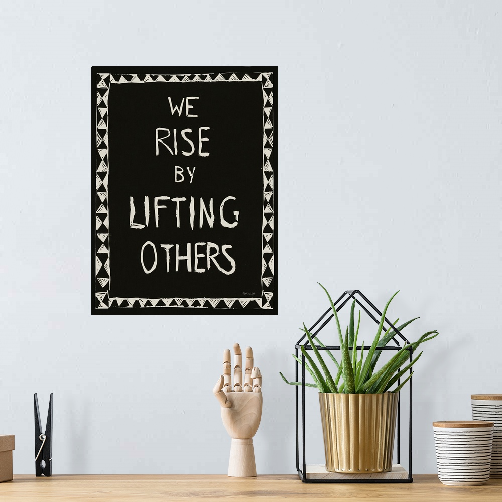 A bohemian room featuring We Rise By Lifting Others