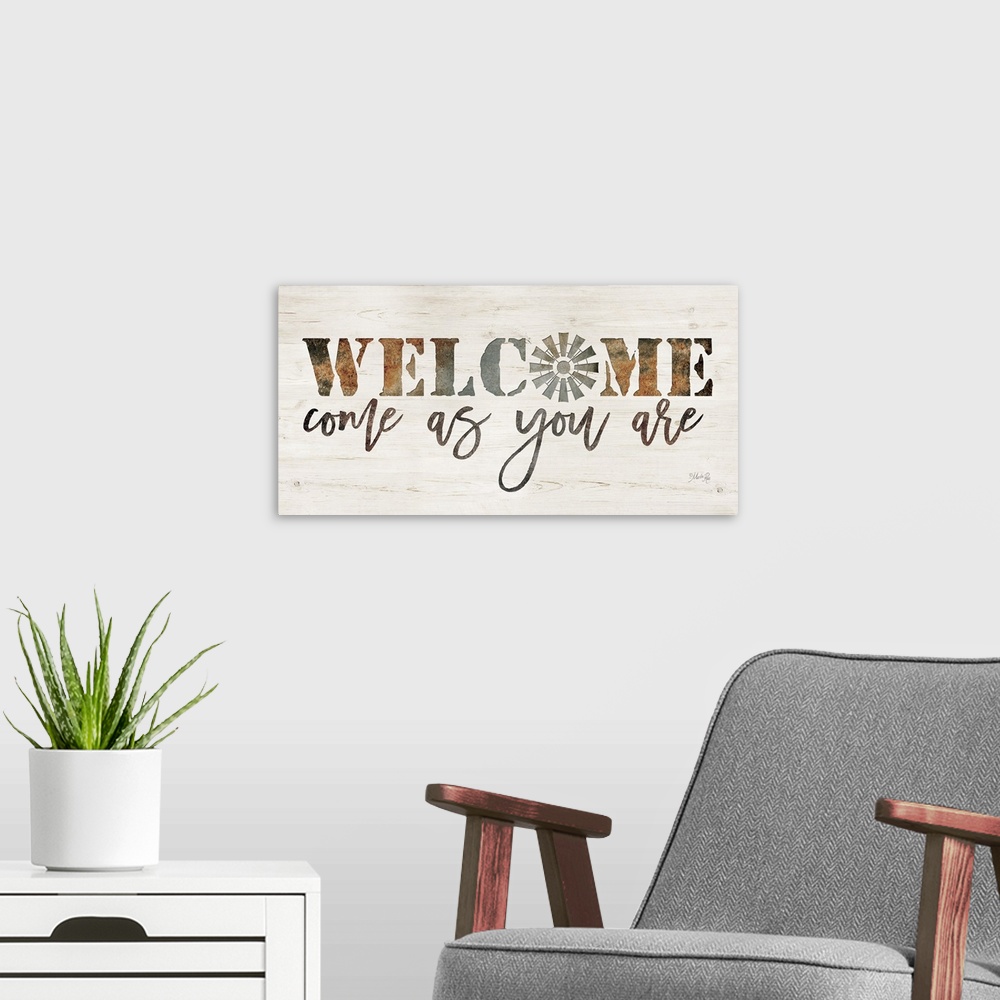 A modern room featuring "Welcome Come As You Are" on a white washed wood background.