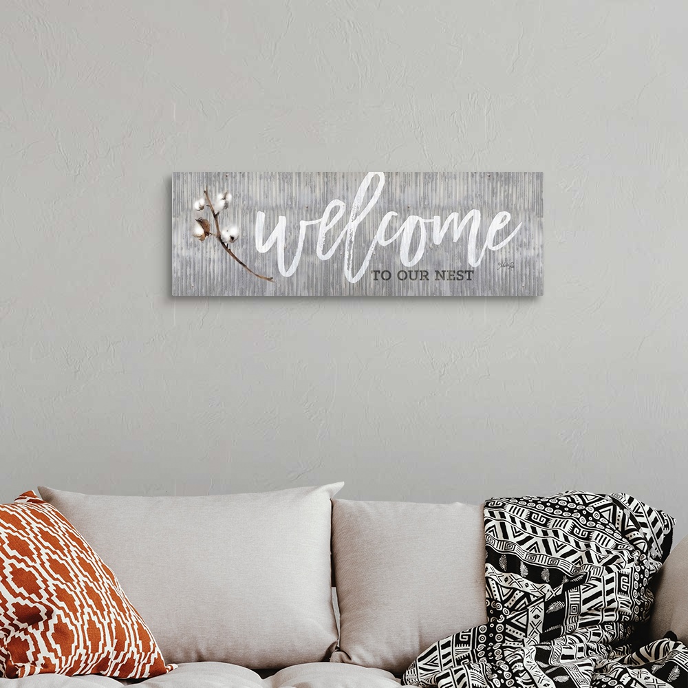 A bohemian room featuring "Welcome to Our Nest" on a gray distressed metal background.