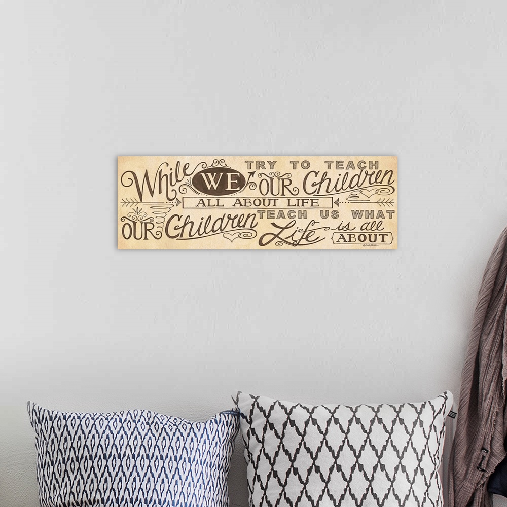 A bohemian room featuring Handlettered home decor art, with dark lettering against a brown distressed background.