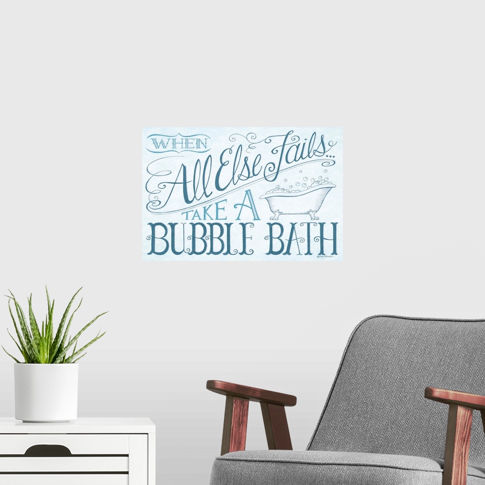 A modern room featuring Handlettered home decor art for a bathroom, with dark blue lettering against a distressed light b...