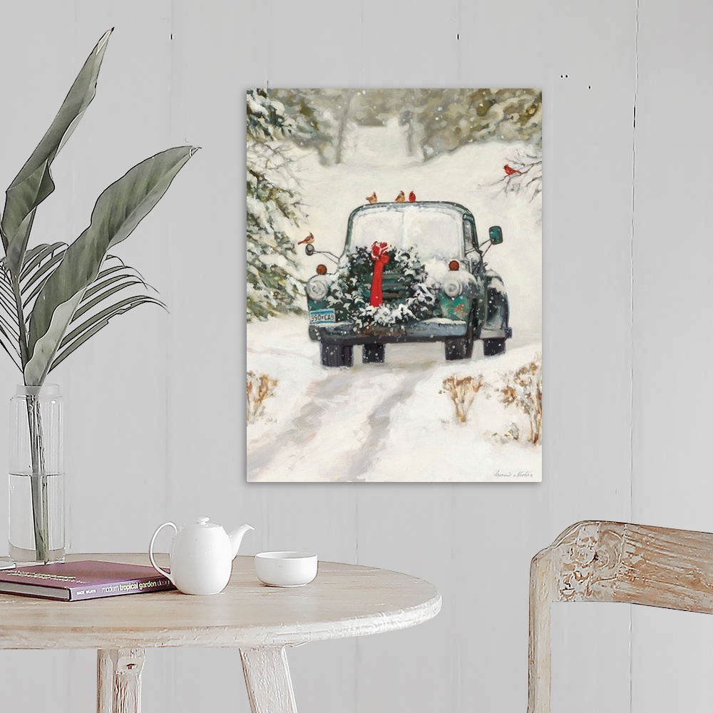 A farmhouse room featuring A truck with a Christmas wreath sitting in the snow in a forest.