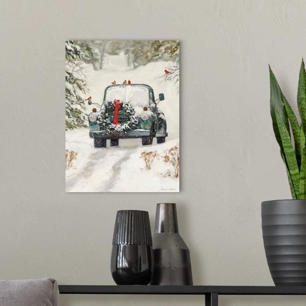 A modern room featuring A truck with a Christmas wreath sitting in the snow in a forest.