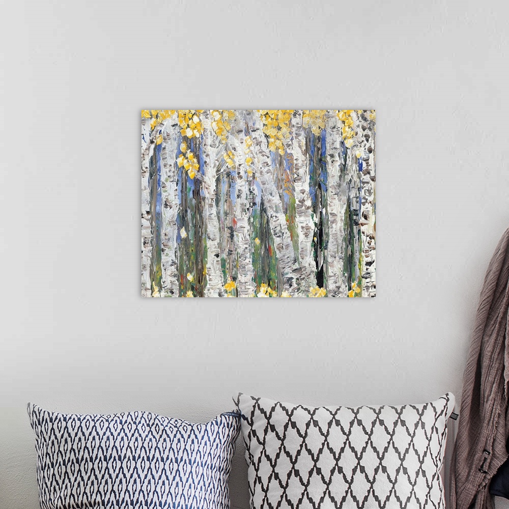 A bohemian room featuring Contemporary art print of a forest of birch trees with bright yellow leaves.