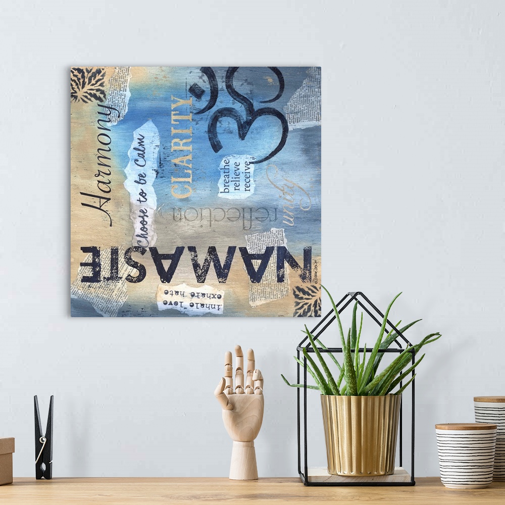 A bohemian room featuring Artwork of yoga-themed words, phrases, and symbols on blue and tan.