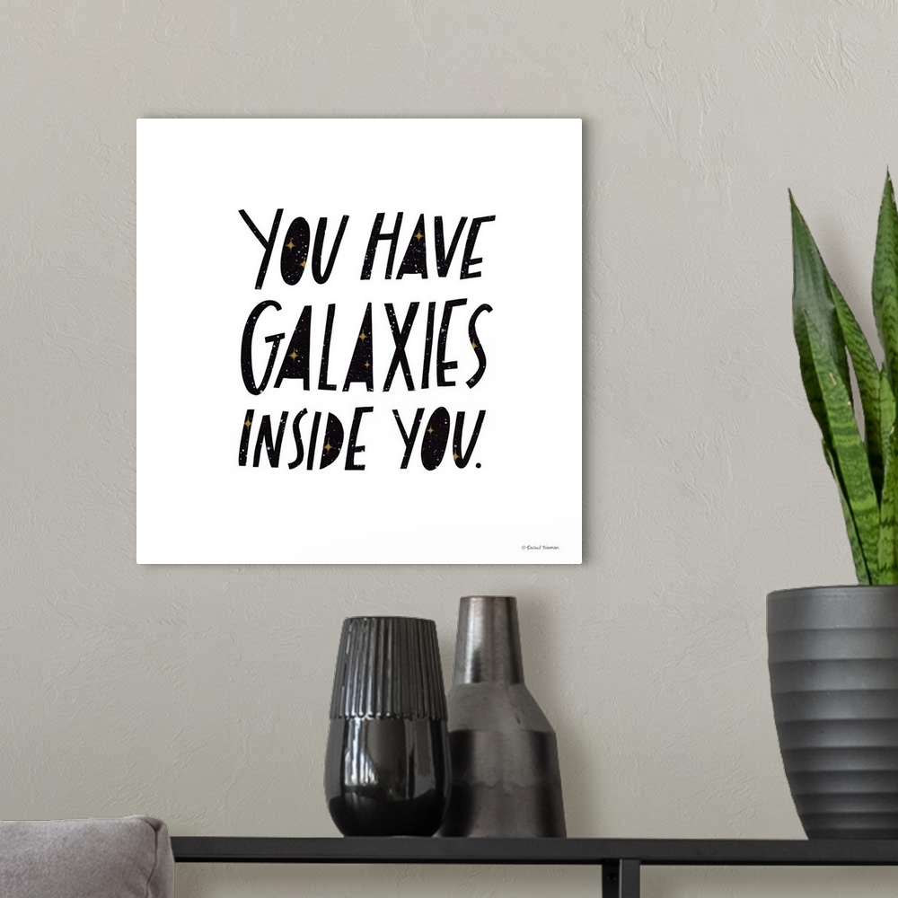 A modern room featuring You Have Galaxies Inside You