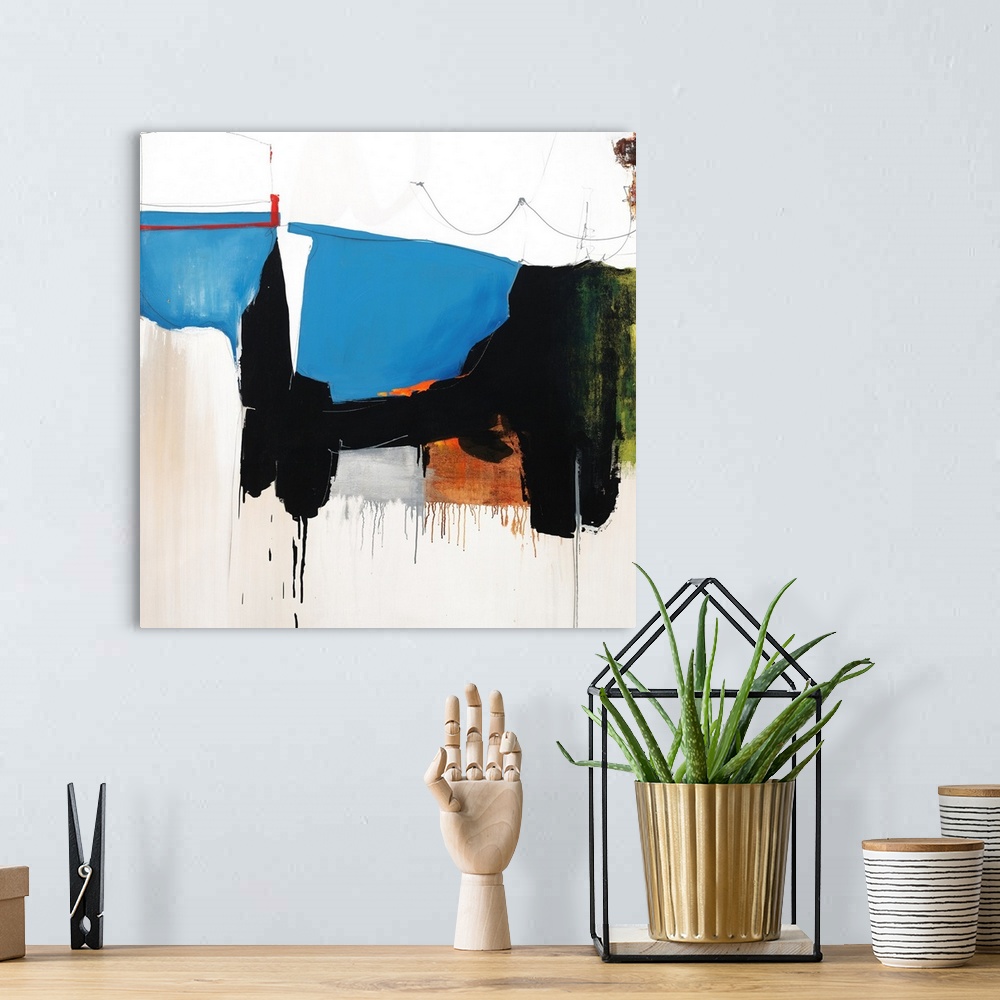A bohemian room featuring Square abstract art with a line of connecting shapes going through the middle and falling towards...