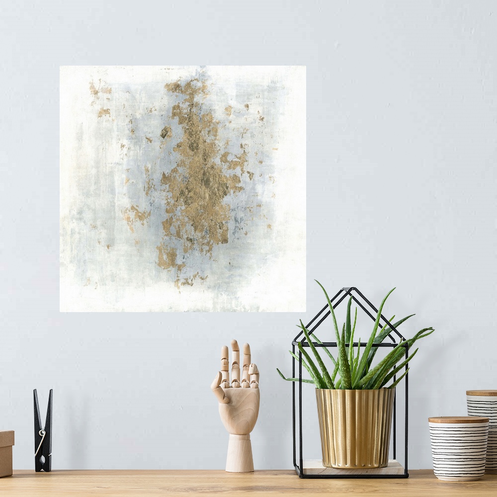 A bohemian room featuring Square abstract art with a cloudy blue and white background and gold foil center.