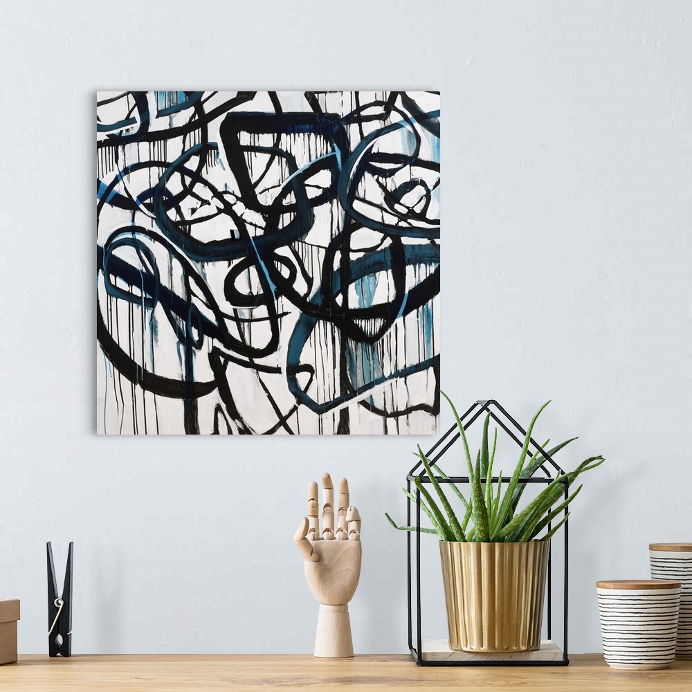 A bohemian room featuring Contemporary abstract painting using harsh black lines moving in all directions dripping blue liq...