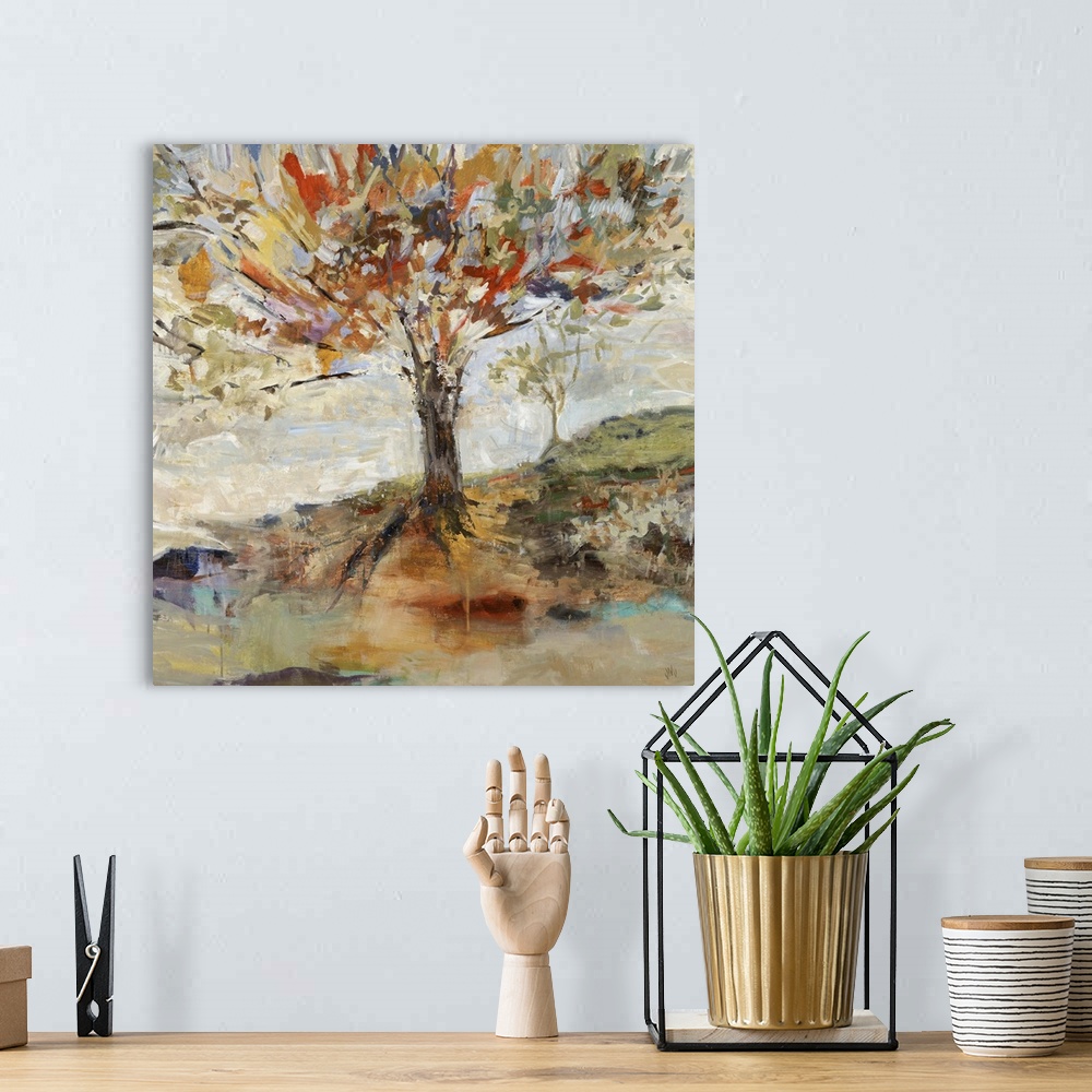 A bohemian room featuring Contemporary landscape painting of a large tree on a hillside with vibrant, multicolored leaves a...