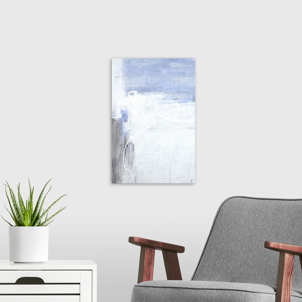 A modern room featuring A long vertical painting of washed colors of gray and blue with dripped paint textures and swirle...