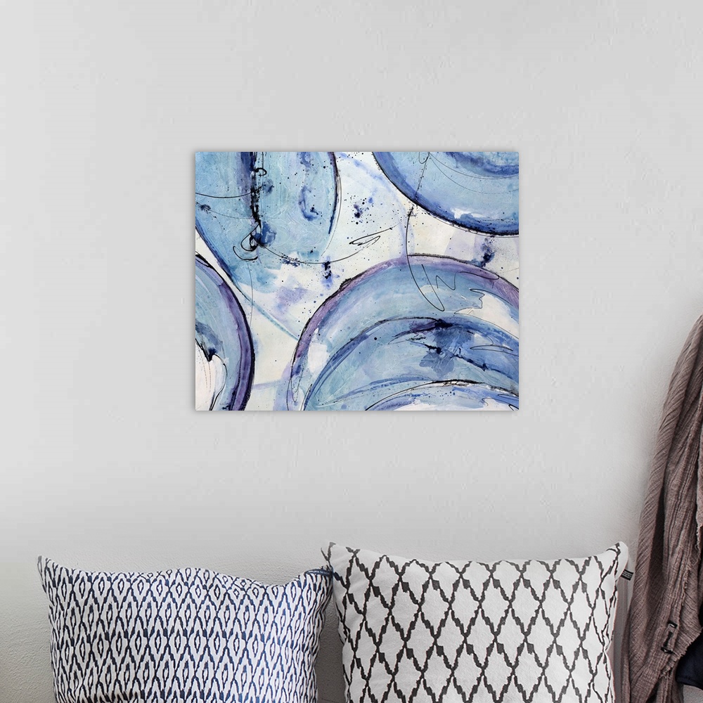 A bohemian room featuring Landscape, abstract artwork on a big canvas of circular shapes with rough edges in cool tones, wi...