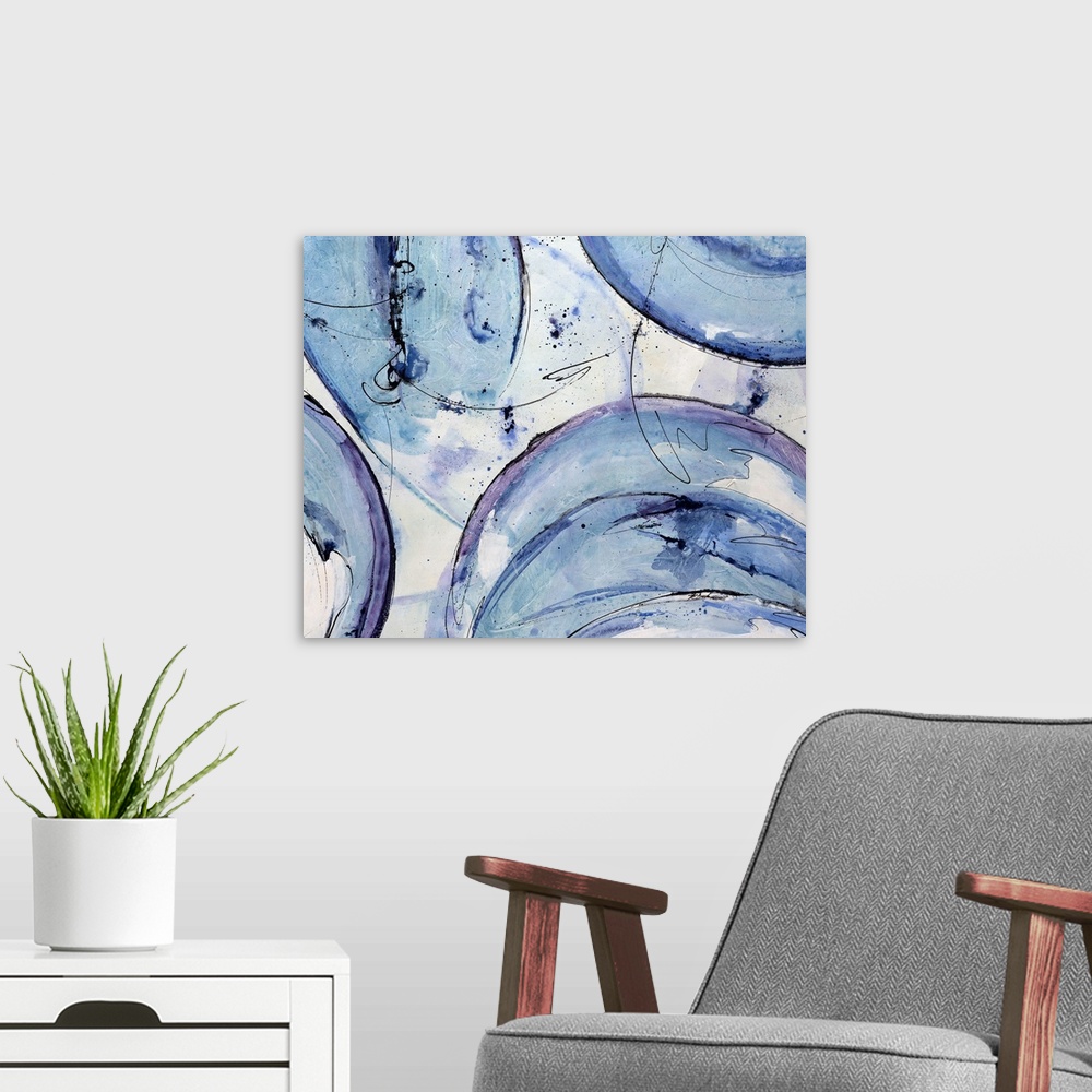 A modern room featuring Landscape, abstract artwork on a big canvas of circular shapes with rough edges in cool tones, wi...