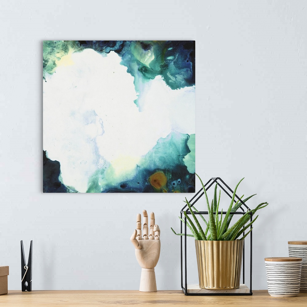 A bohemian room featuring Square abstract art with a bright white splotch in the center and colors forming together around ...