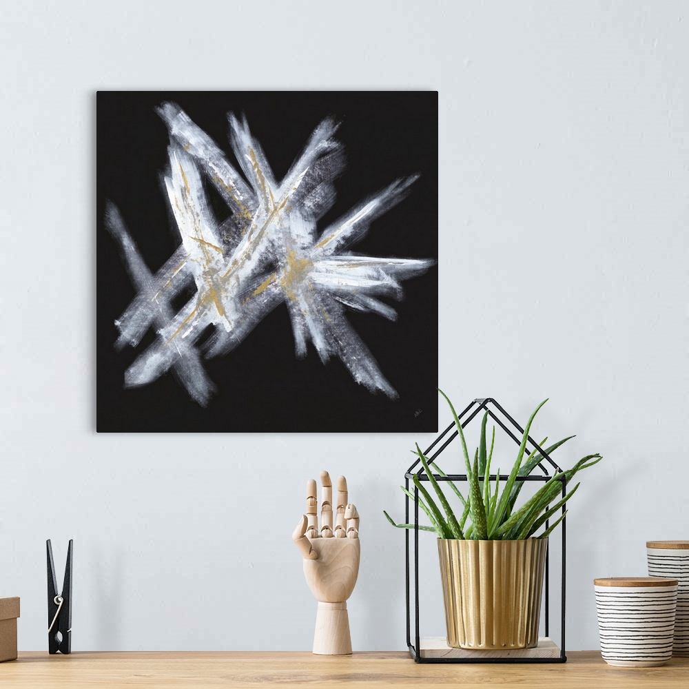 A bohemian room featuring Square abstract painting with a solid black background that has white crossing brushstrokes on to...