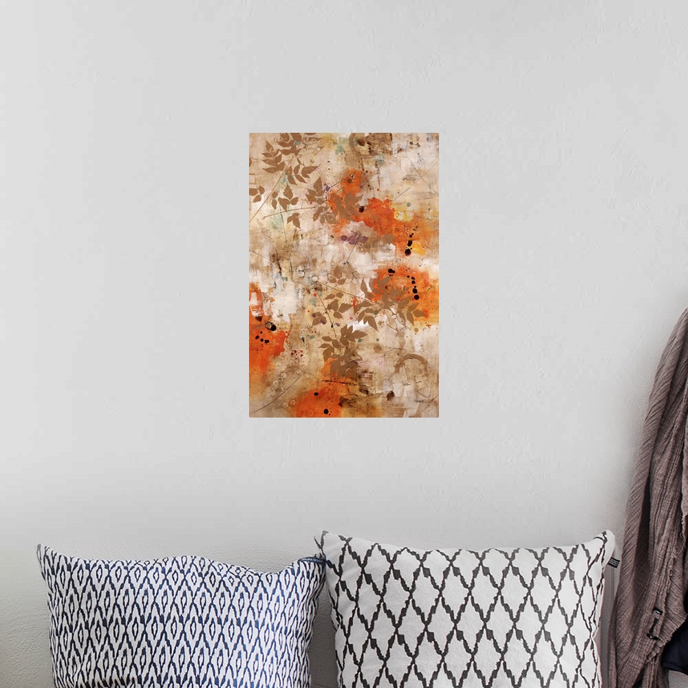 A bohemian room featuring Abstract artwork that has splashes of orange and small branches with leaves painted over the print.