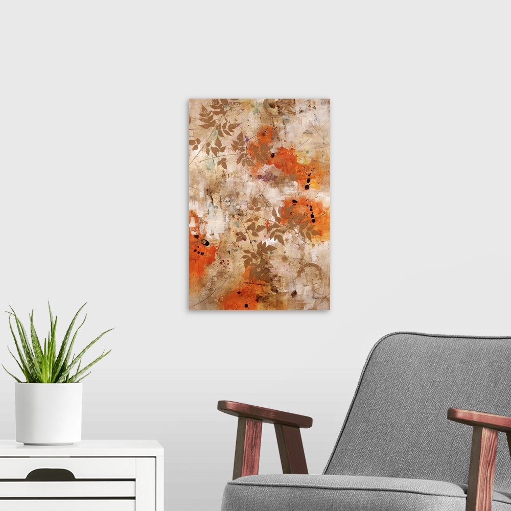 A modern room featuring Abstract artwork that has splashes of orange and small branches with leaves painted over the print.