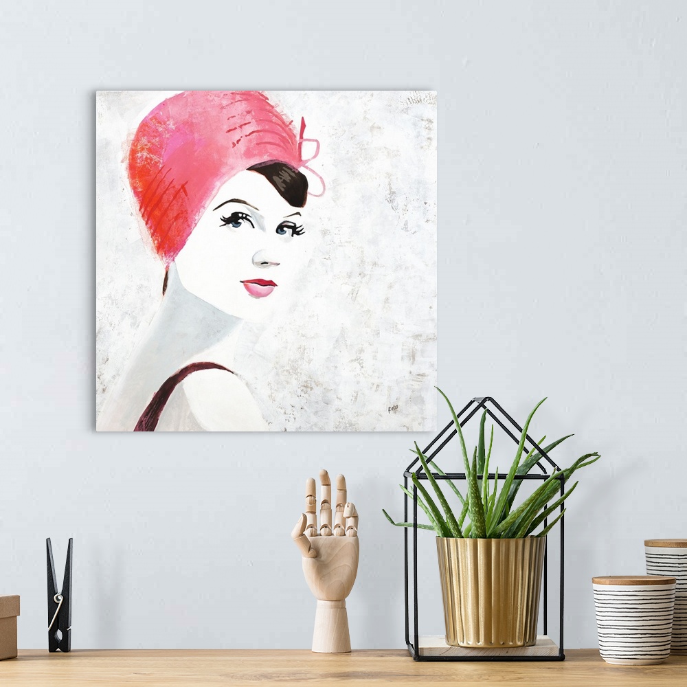 A bohemian room featuring Square painting of a woman with pink lips and a pink hat on a white background with gray and gold...