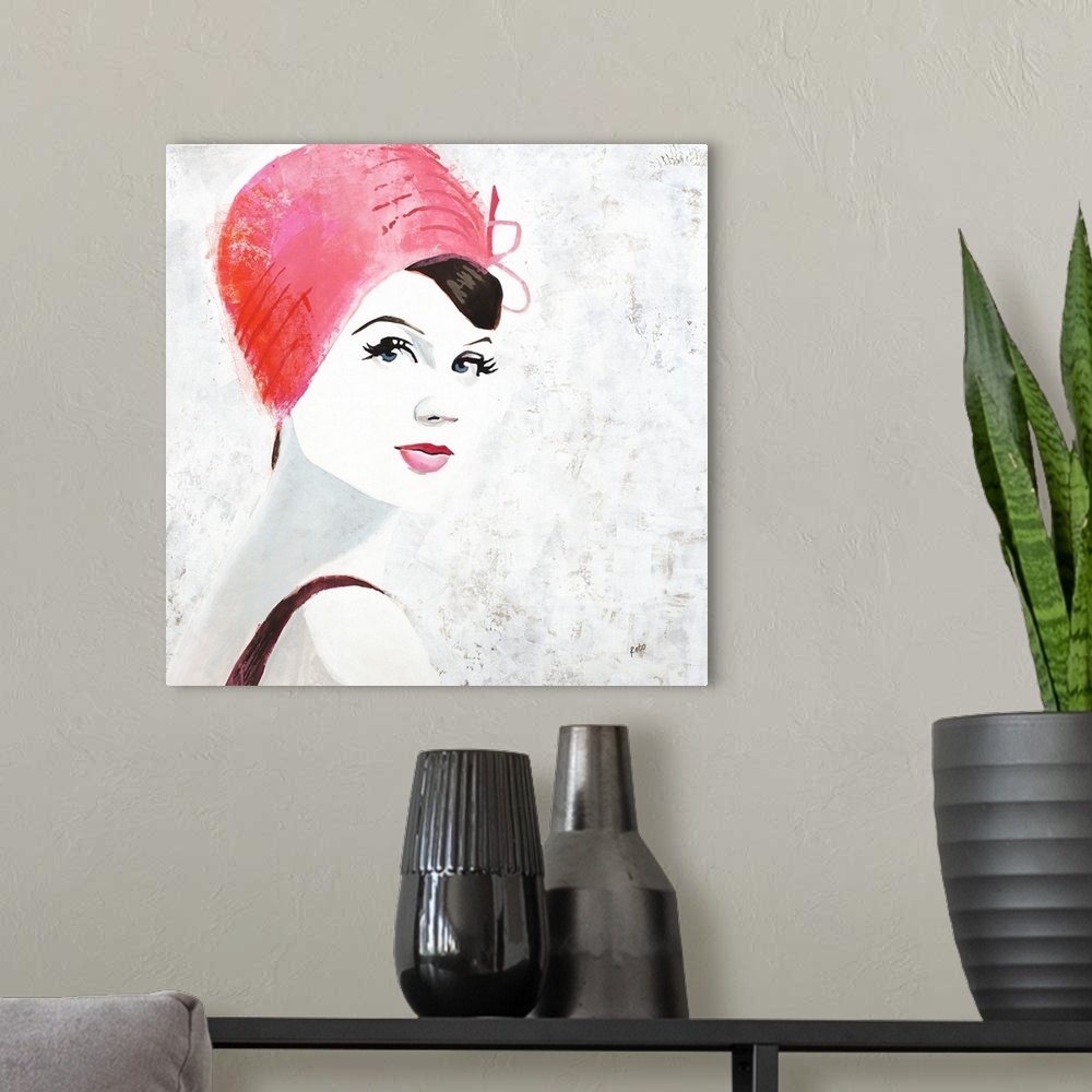 A modern room featuring Square painting of a woman with pink lips and a pink hat on a white background with gray and gold...