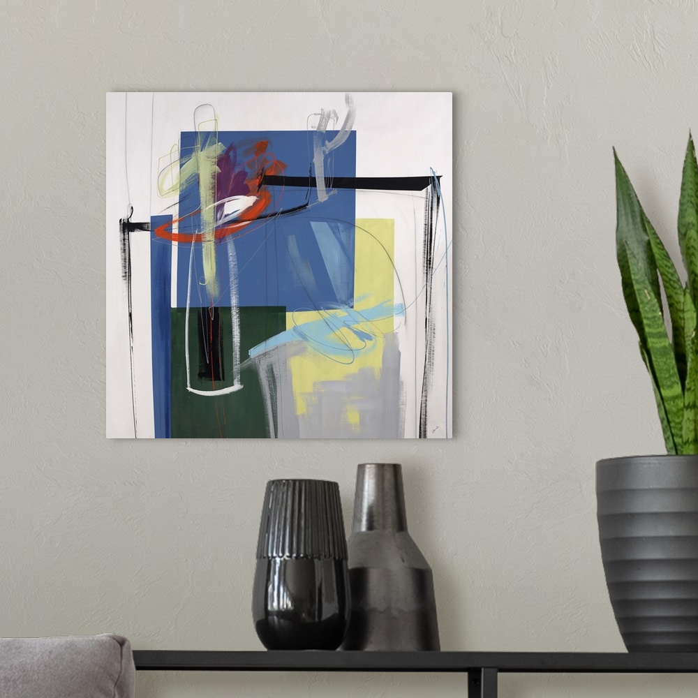A modern room featuring Abstract painting using vibrant colors in different different shapes against a neutral background.