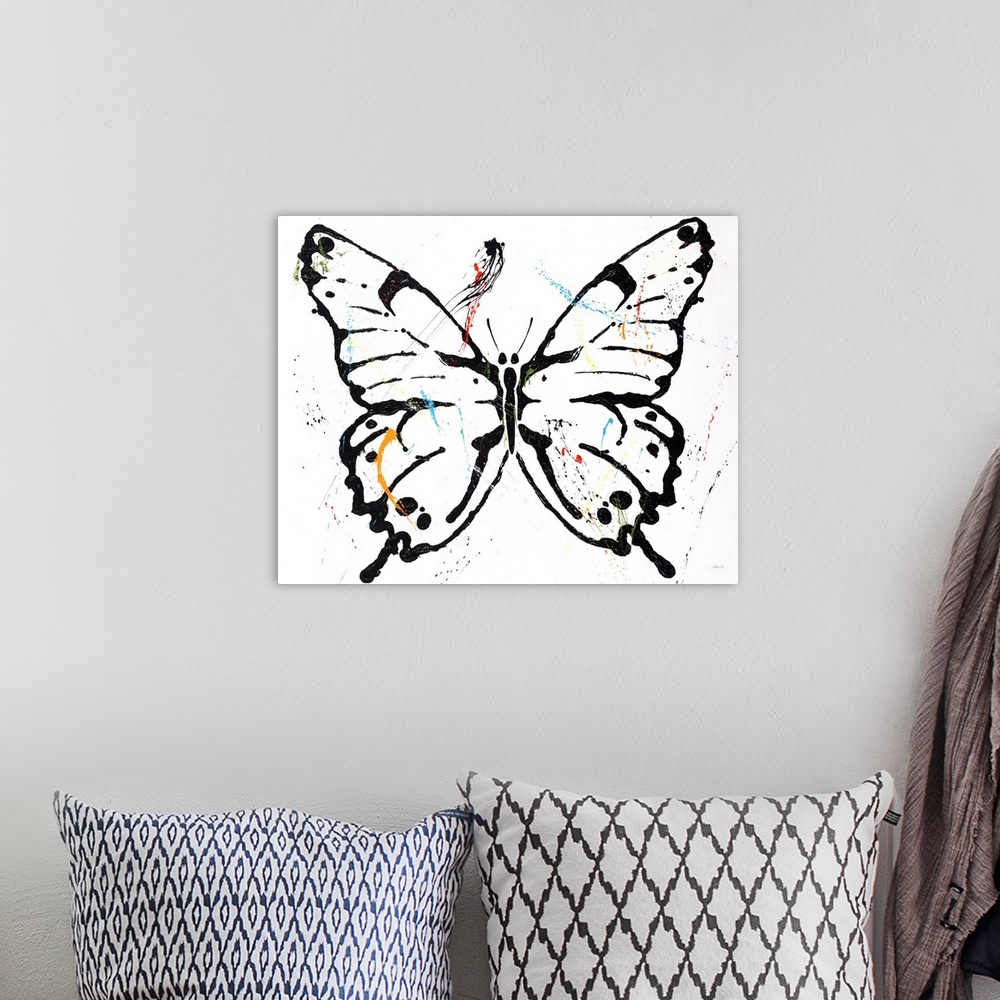 A bohemian room featuring Black outlined butterfly with colorful paint splatter on top on a white background.