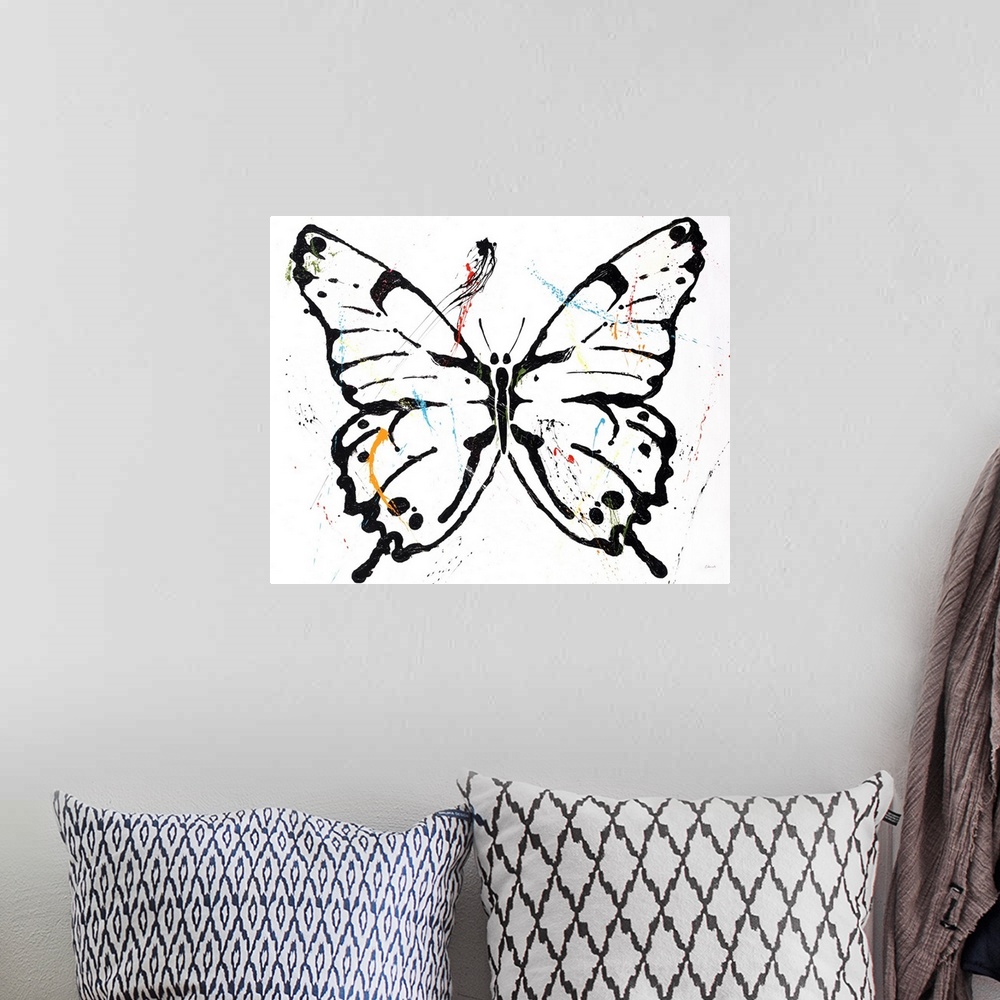 A bohemian room featuring Black outlined butterfly with colorful paint splatter on top on a white background.