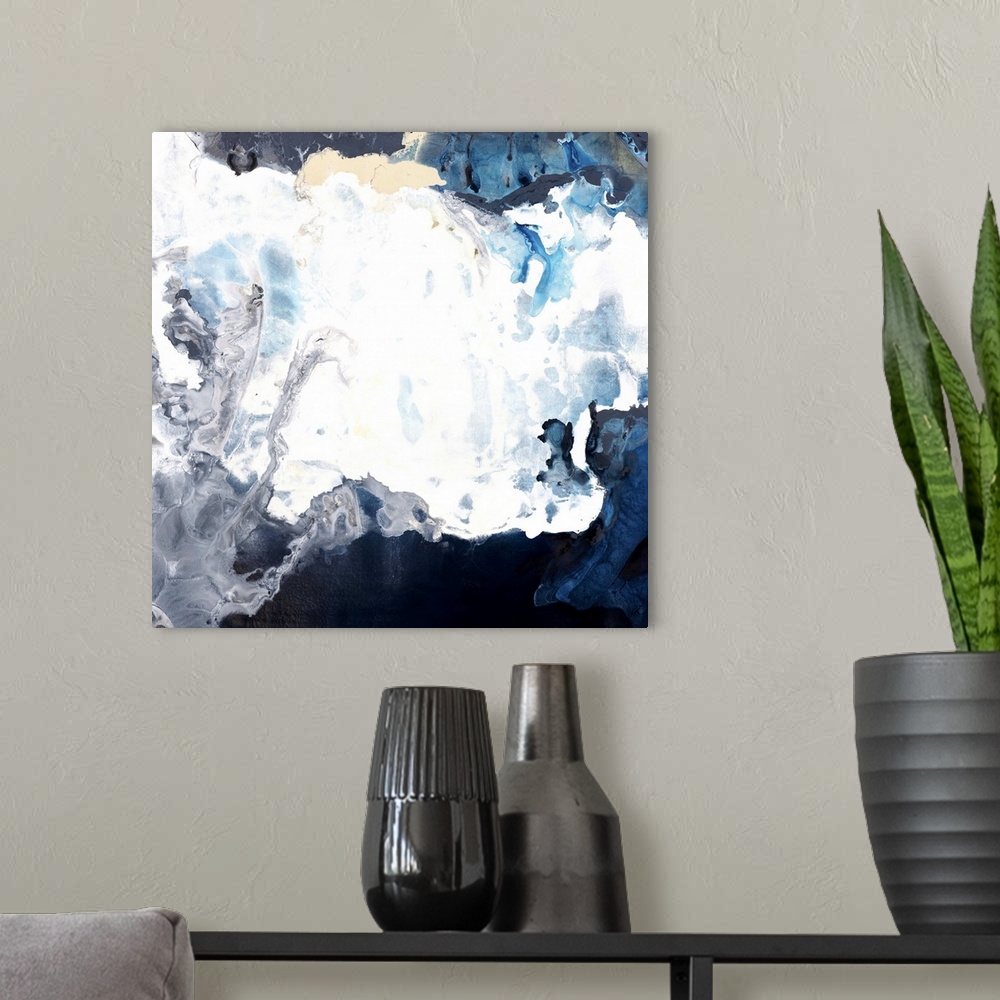 A modern room featuring Contemporary abstract artwork in white and dark blue resembling crashing waves.