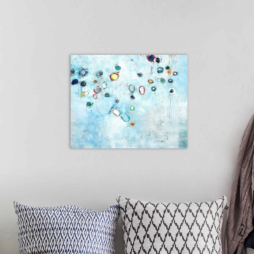 A bohemian room featuring Contemporary abstract painting using pale distressed blue and small colorful organic shapes.