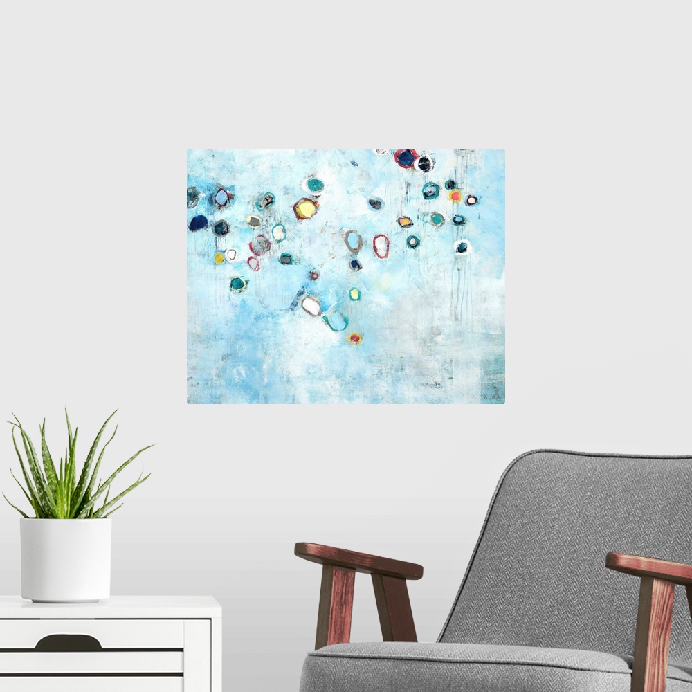 A modern room featuring Contemporary abstract painting using pale distressed blue and small colorful organic shapes.