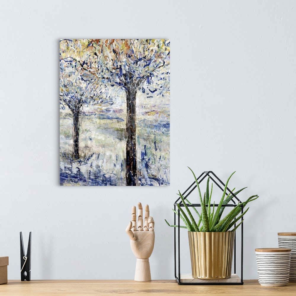 A bohemian room featuring Vertical contemporary painting of two trees in textured brush strokes.