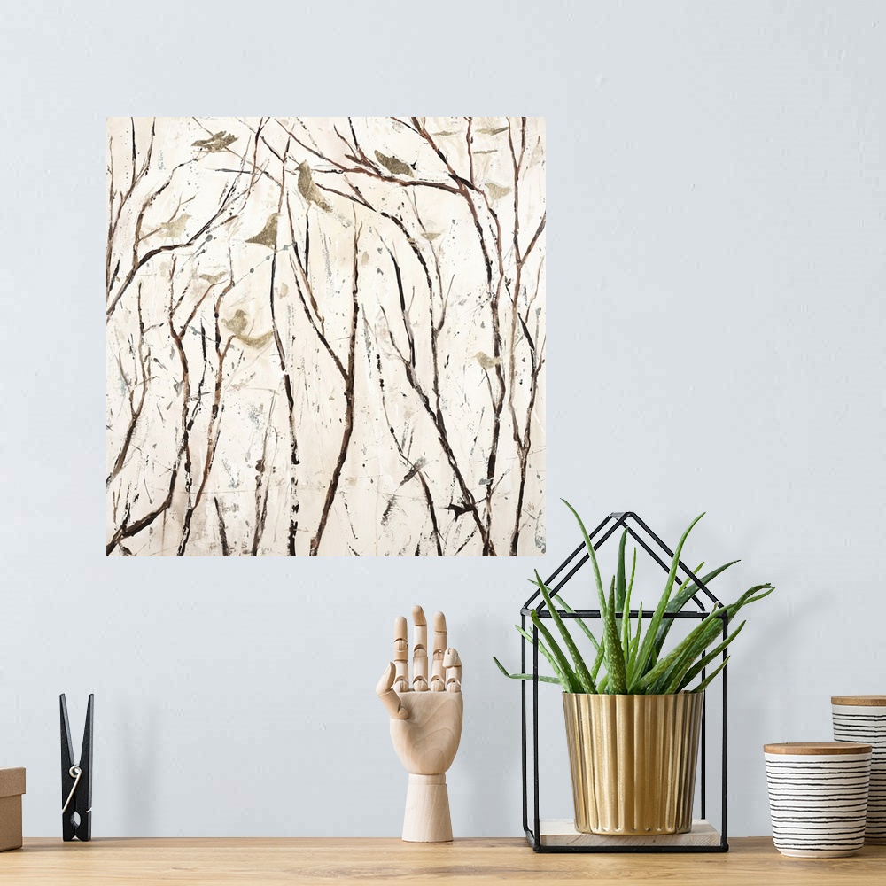 A bohemian room featuring Square painting in neutral white and brown hues with gold birds perched on bare branches.
