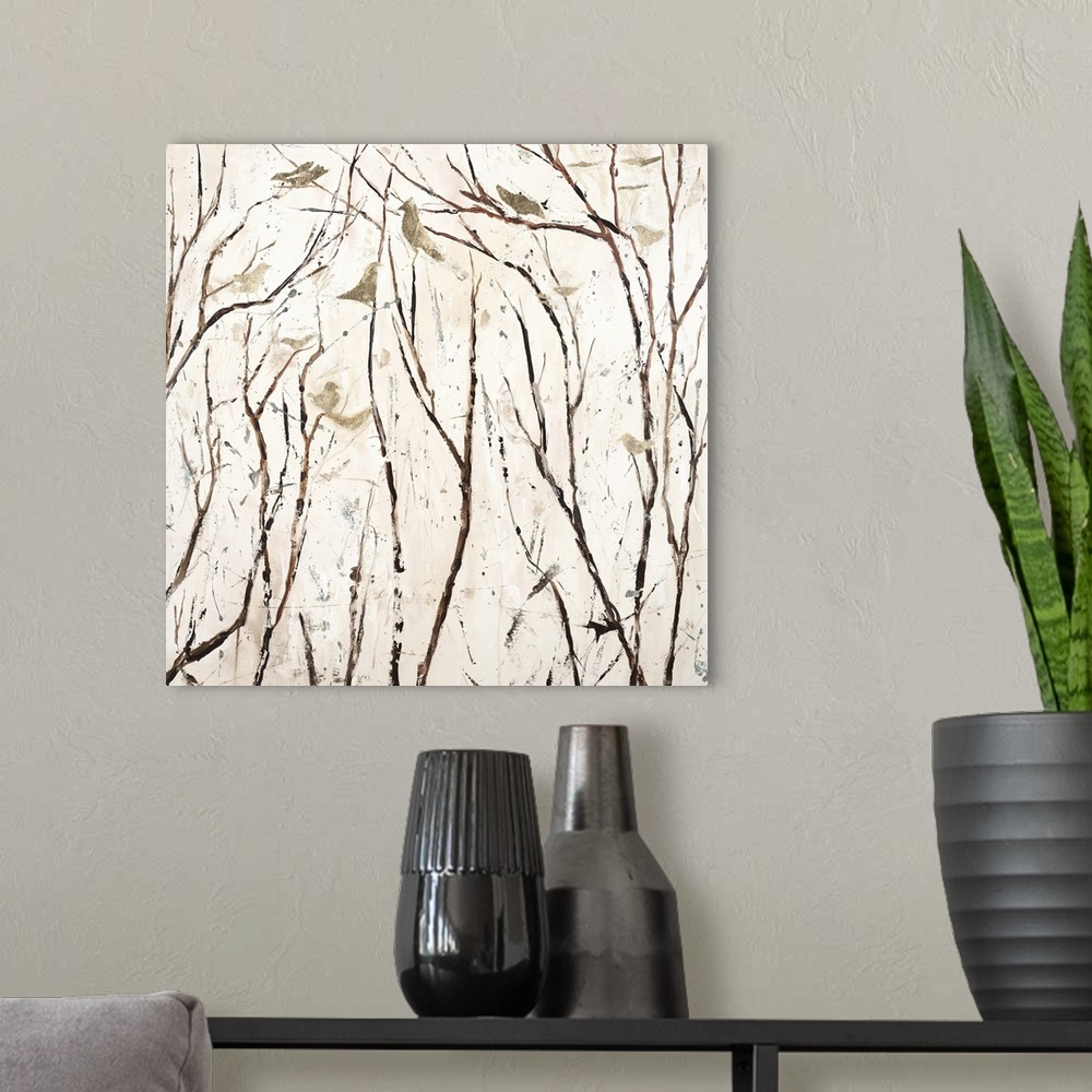 A modern room featuring Square painting in neutral white and brown hues with gold birds perched on bare branches.